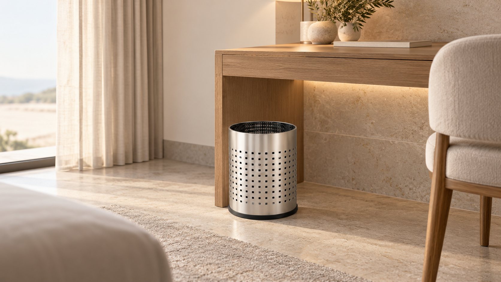 JVD perforated waste basket in a hotel room